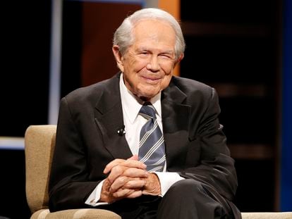 Rev. Pat Robertson poses a question to a Republican presidential candidate during a forum at Regent University in Virginia Beach, Virginia, on October 23, 2015.