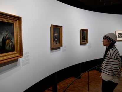 A visitor observes three works by Francisco Goya – 'Witches' Sabbath,  Witches' Flight and The Bewitched Man' – in the exhibition titled 'Goya and Munch: Modern Prophecies', at the Munch Museum in Oslo, on December 6, 2023.