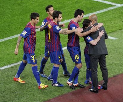 Leo Messi embraces Pep Guardiola after scoring against Espanyol.  
