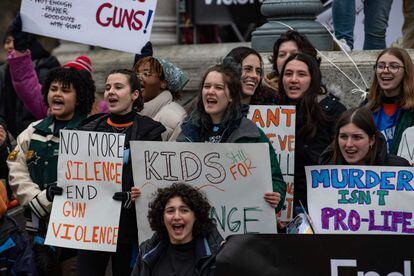 Demonstrators hold signs during an anti-gun violence rally in Boston, Massachusetts, on March 25, 2023