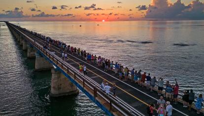 Attendees watch and toast the sunset at a Florida Keys bicentennial celebration