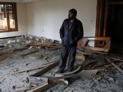 A man surveys the damage caused by the Taliban attack at the Spanish embassy in Kabul.