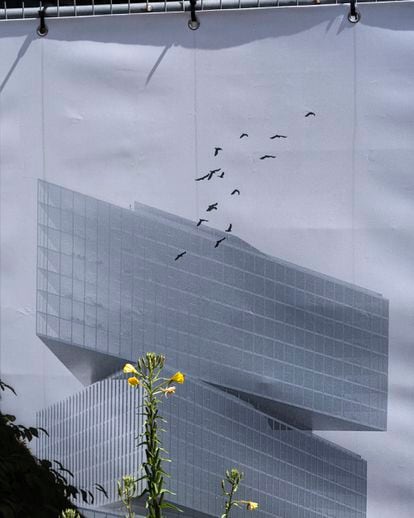 A sign hanging from a fence reproducing a building, plant and birds in Amsterdam, in 2022. 