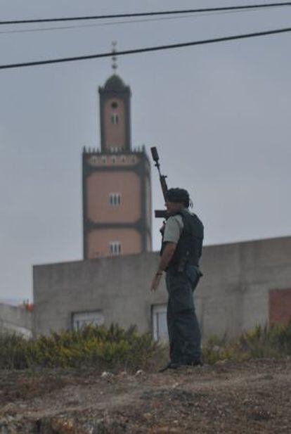A Civil Guard patrols near the troubled El Príncipe neighborhood in Ceuta.