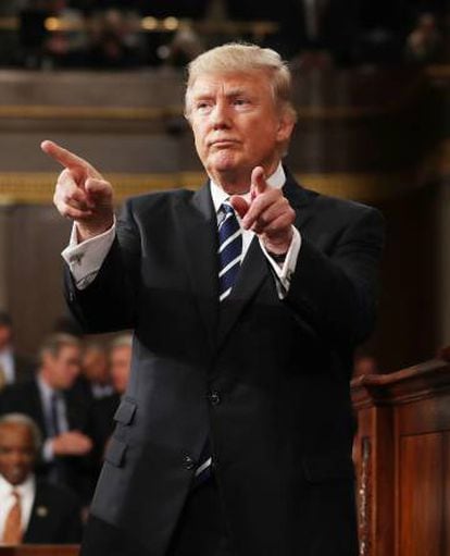 Trump reacts after delivering his first address to a joint session of Congress on Tuesday.
