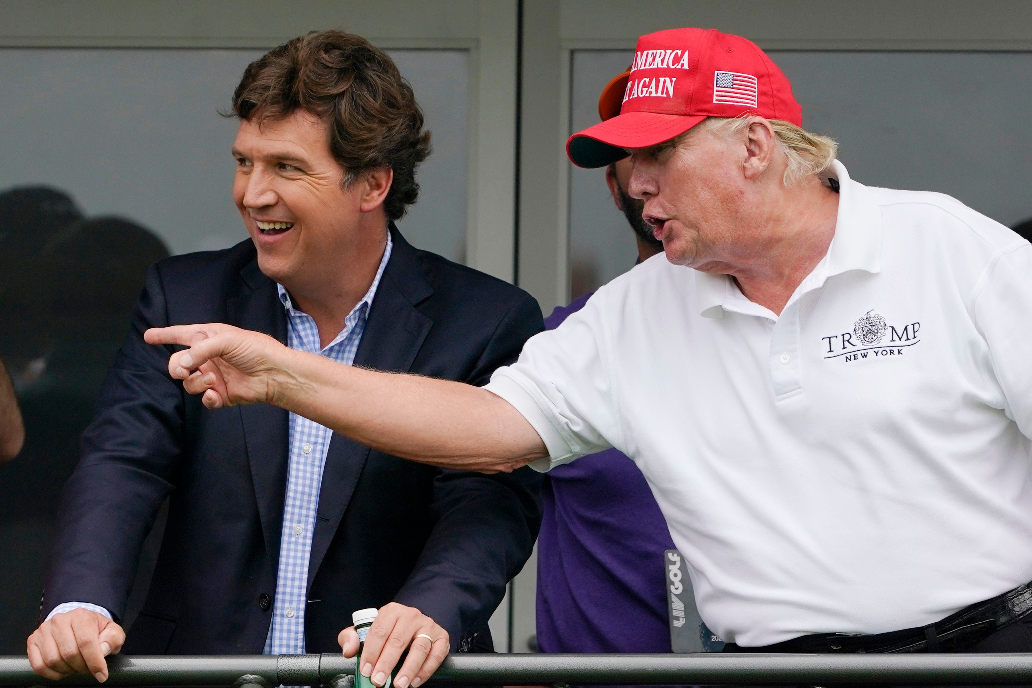 Tucker Carlson (left) and Donald Trump, in Bedminster, New Jersey, in 2022.