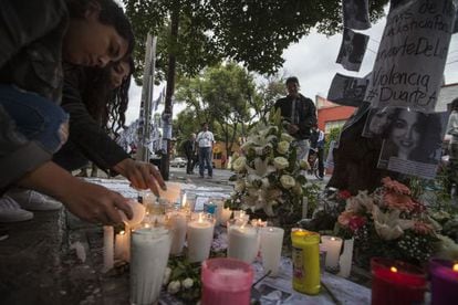 People light candles in Mexico City where Rubén Espinosa and four women were murdered on July 31.
