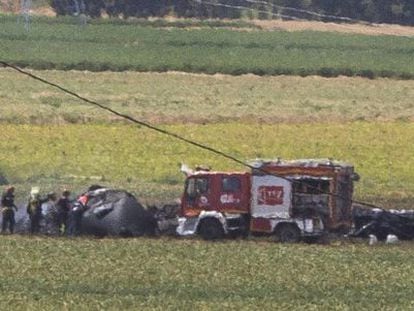 Firefighters at the scene of the Airbus A400M accident on May 9.
