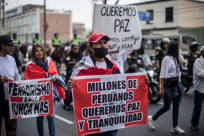 Demonstrators march on an avenue in Lima, during a protest on December 16, 2022.
