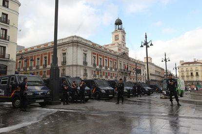 Police officers man the cordoned-off area in Madrid's Sol square on Tuesday.