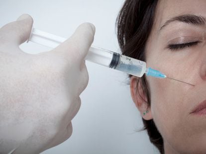 A woman receives a botox injection.
