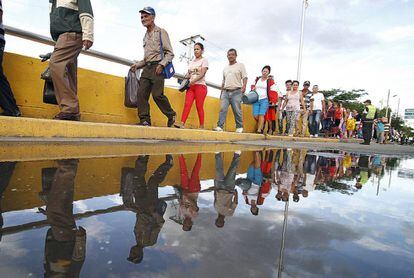 Venezuelans cross into Colombia to buy basic goods.