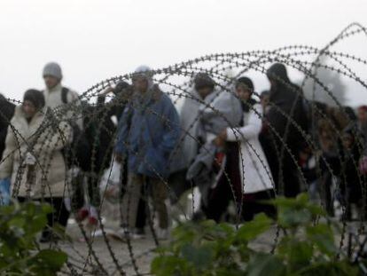 A group of refugees crosses the border between Greece and Macedonia at the weekend.