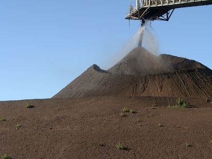 A crane transports iron powder at a mine in Australia in June this year.
