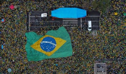 Bolsonaro supporters display a huge national flag as they celebrate Brazil's 200th anniversary of independence.
