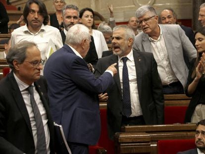 Angry scenes between lawmakers inside the Catalan parliament on Thursday.