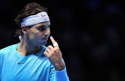 Spain&#039;s Rafael Nadal asks for a review of a line call during his group A singles match against David Ferrer.