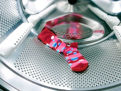 A lonely sock inside a washing machine.