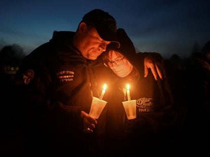 People attend a vigil after a shooting at Perry High School, in Perry, Iowa, on January 4, 2024.