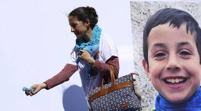Patricia Ramírez passes by a photo of her son, victim Gabriel Cruz, at a protest for the return of the child.