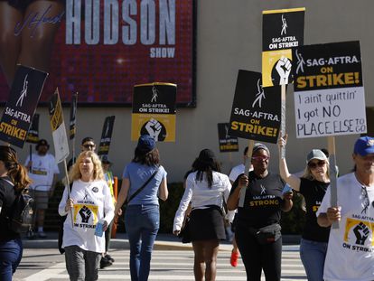 SAG-AFTRA members and supporters picket outside Warner Brothers Studios on day 99 of their strike in Burbank, California, October 20, 2023.