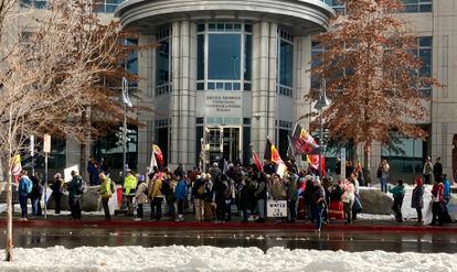 Dozens of tribe members and other protesters beating drums and waving signs rally in front of the federal courthouse in Reno, Nev. Thursday, Jan. 5, 2023.