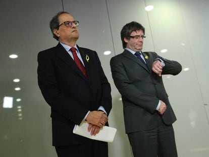 Newly elected Catalan premier Quim Torra and Carles Puigdemont.