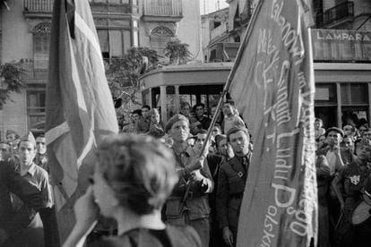 Gerda Taro, photographed on June 12, 1937 with her back to the camera while she covered a funeral during the Spanish Civil War.