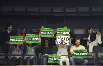 Environmentalists protest the new law at the Brazilian Congress last week.