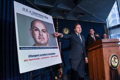 In this file photo taken on February 11, 2020, US Attorney for the Southern District of New York, Geoffrey Berman (C), announces the indictment against Lawrence Ray aka "Lawrence Grecco in New York City.
