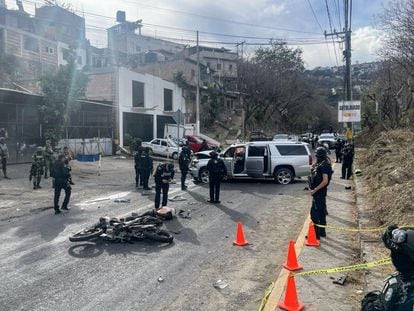 Police officers at the scene of the attack on Taxco Mayor Mario Figueroa on February 15 in the state of Guerrero, Mexico.