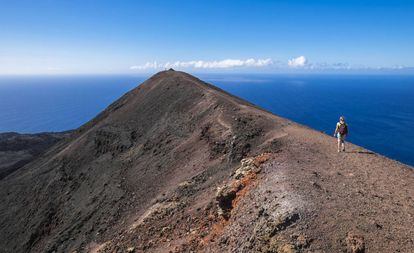 Located on the island of La Palma, this volcano last erupted in 1971 sending 40 million cubic meters of pyroclastic matter into the air. Now visitors can hike up the upper part of the orange-tinged peak, which still continues to emit hot gasses.