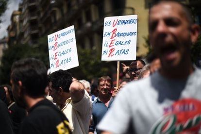 Taxi drivers protest in Barcelona (Spain), July 2014. A placard calls the company "Usurpers, Con men, Ilegal, Pirates."