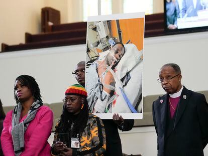Family members and supporters hold a photograph of Tyre Nichols at a news conference in Memphis, Tenn., Jan. 23, 2023.