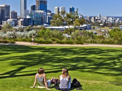 Two young people relax in Kings Park in Perth, Australia.
