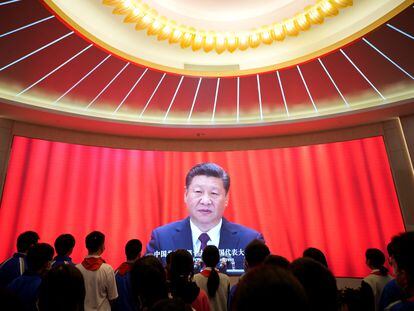 Students watched the image of China's President Xi Jinping on a screen at the memorial center of the first CPC congress in Shanghai on Friday.