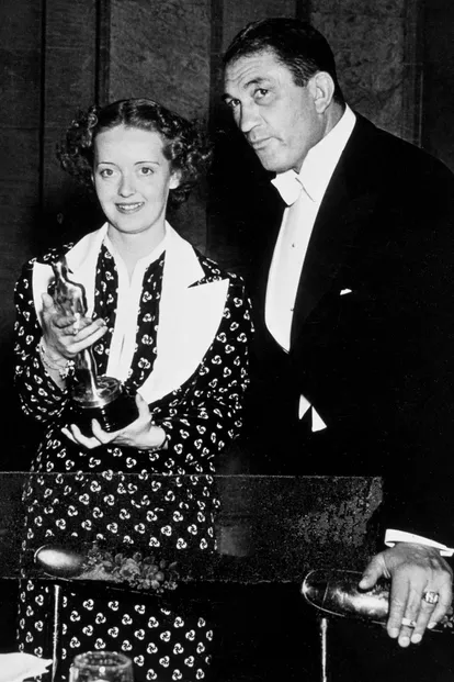 Bette Davis, in 1936, with her Oscar for 'Dangerous' in hand.