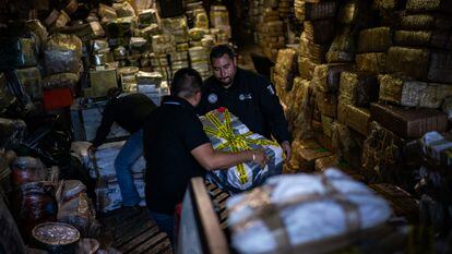 Officials from Mexico's attorney general's office unload hundreds of pounds of fentanyl and meth.