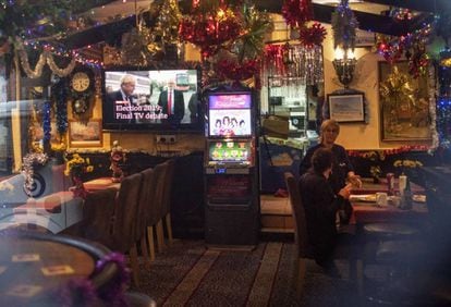 A television in a bar in Gibraltar shows a commercial for the British election debate.