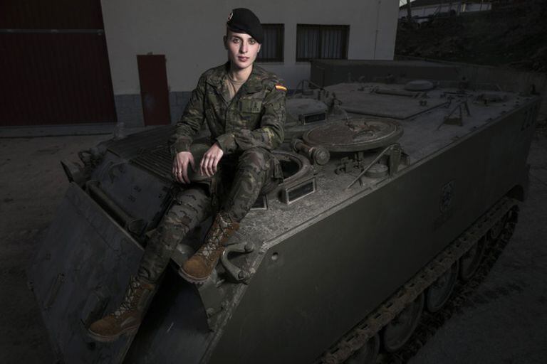 Natalia Ortiz on an armored wheeled vehicle