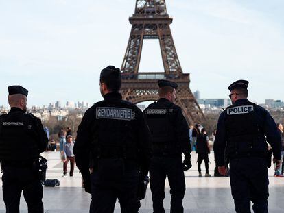 French police and French gendarmes patrol at the Trocadero square near the Eiffel Tower in Paris, France, March 4, 2024.