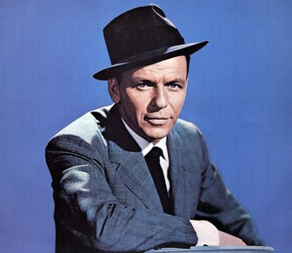 Frank Sinatra, ‘The Voice,’ posing in his signature suit and hat.