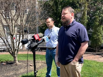 Sean Halsey, right, who was injured along with his children in a shooting in Maine last week, speaks at a news conference in Portland, Maine, Friday, April 28, 2023.