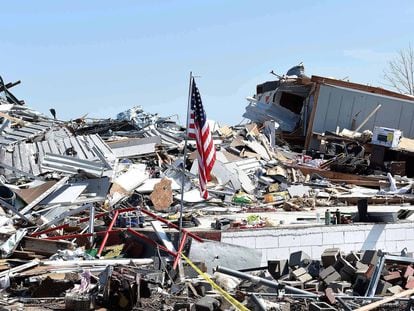 A new American flag flies over a storm-damaged area after a tornado struck in Rolling Fork, Mississippi, on March 26, 2023.