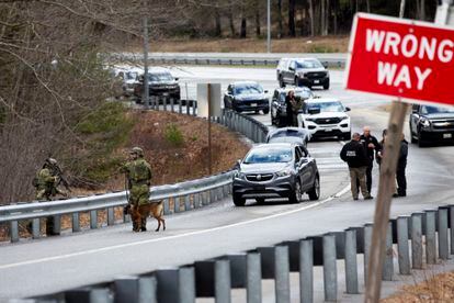 Members of law enforcement investigate a scene where people were injured in a shooting on Interstate 295, in Yarmouth, Maine, Tuesday, April 18, 2023