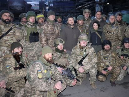 Gennadiy, bottom left, looking at the camera, during Volodymyr Zelenskiy's visit to Bakhmut on December 20.