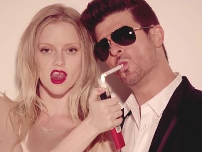 Elle Evans and Robin Thicke in the video for 'Blurred Lines'