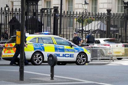 Police at the scene after a car collided with the gates of Downing Street in London in London, Thursday, May 25, 2023.