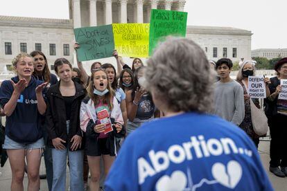 Activists for and against abortion demonstrate in front of the United States Supreme Court in Washington.