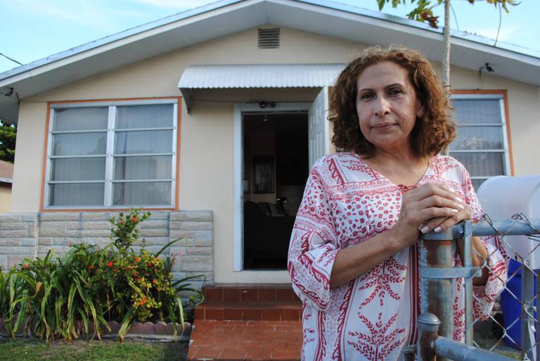María Edith Lau outside her house in Miami.